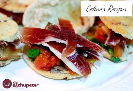 Bites of ham with mushrooms and tomato