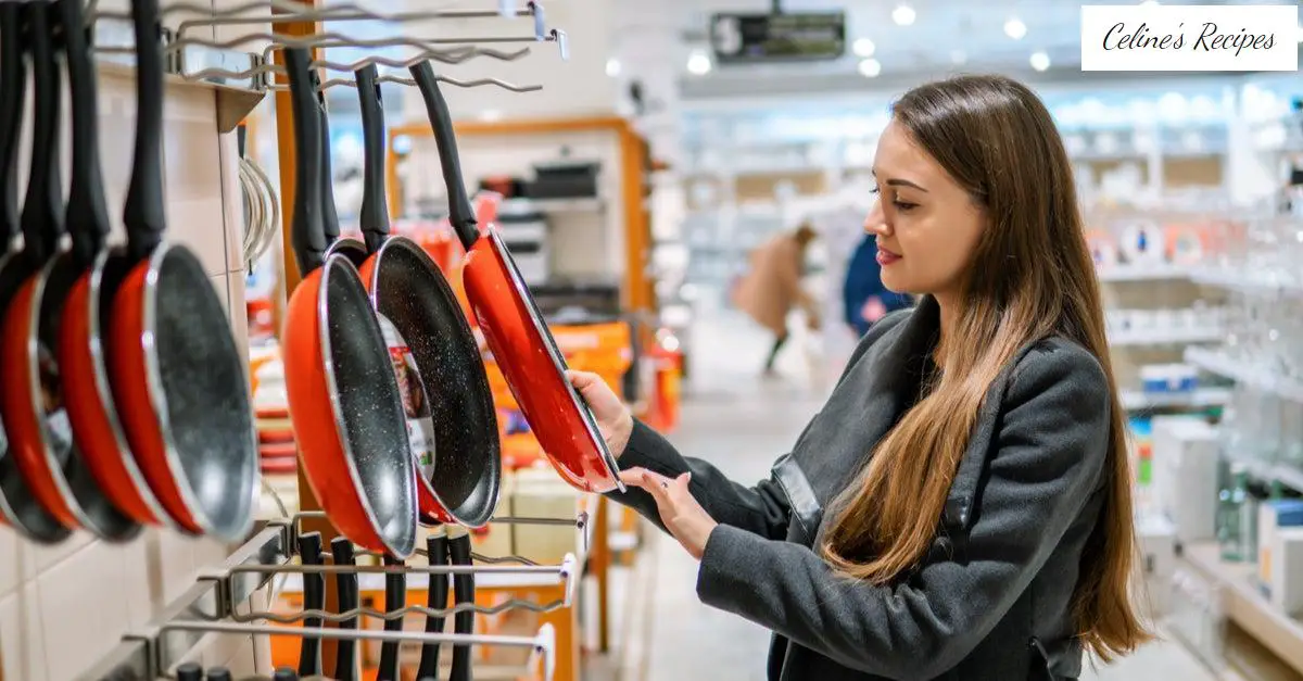 Woman looking at pans in trade