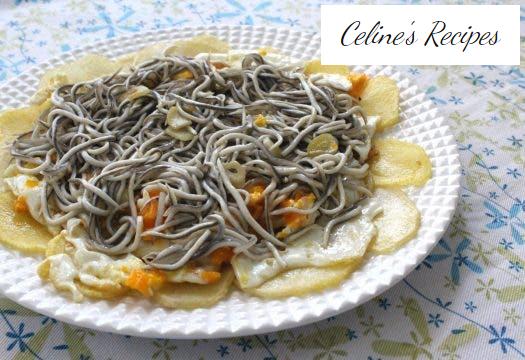 Broken eggs with baby eels in garlic