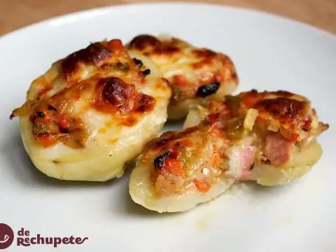 Potatoes stuffed with vegetables and baked bacon