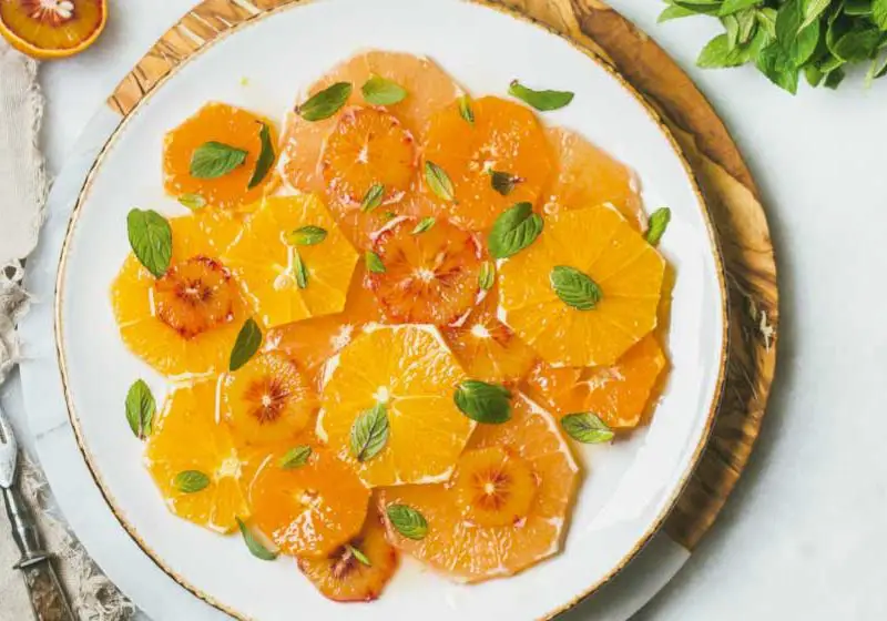 Mandarin salad with orange, honey and mint leaves